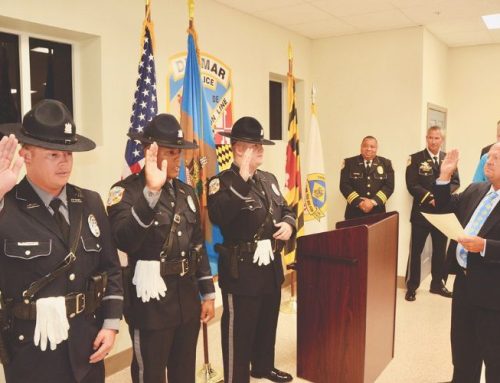 Three Delmar police officers take oath of office before crowd of citizens