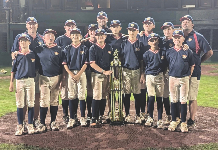 DELMARVA ACES 43 Youth baseball team posing on the field with a tall championship trophy in the center.